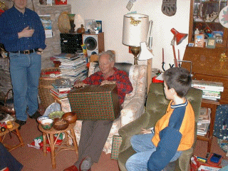 Dad opening his present.gif (250789 bytes)